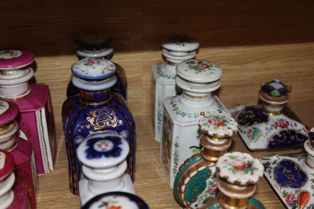 A collection of French porcelain scent bottles and a teapot (24)